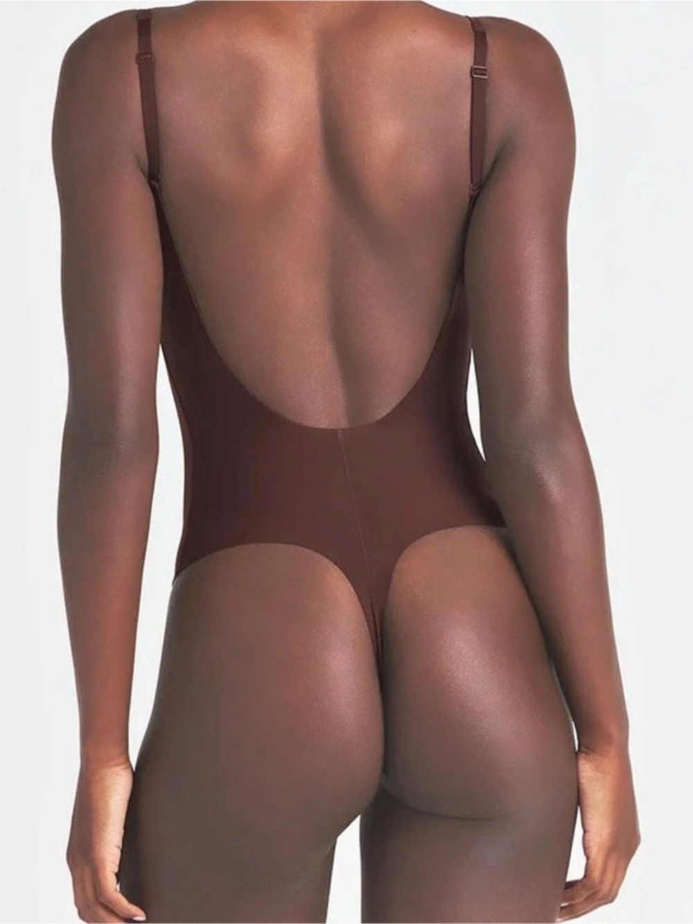 Skims low back thong bodysuit in Cocoa size
Medium
